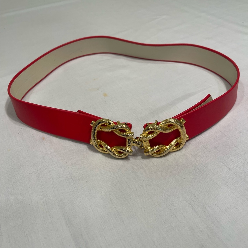 red leather belt with a gold-tone chainlink buckle